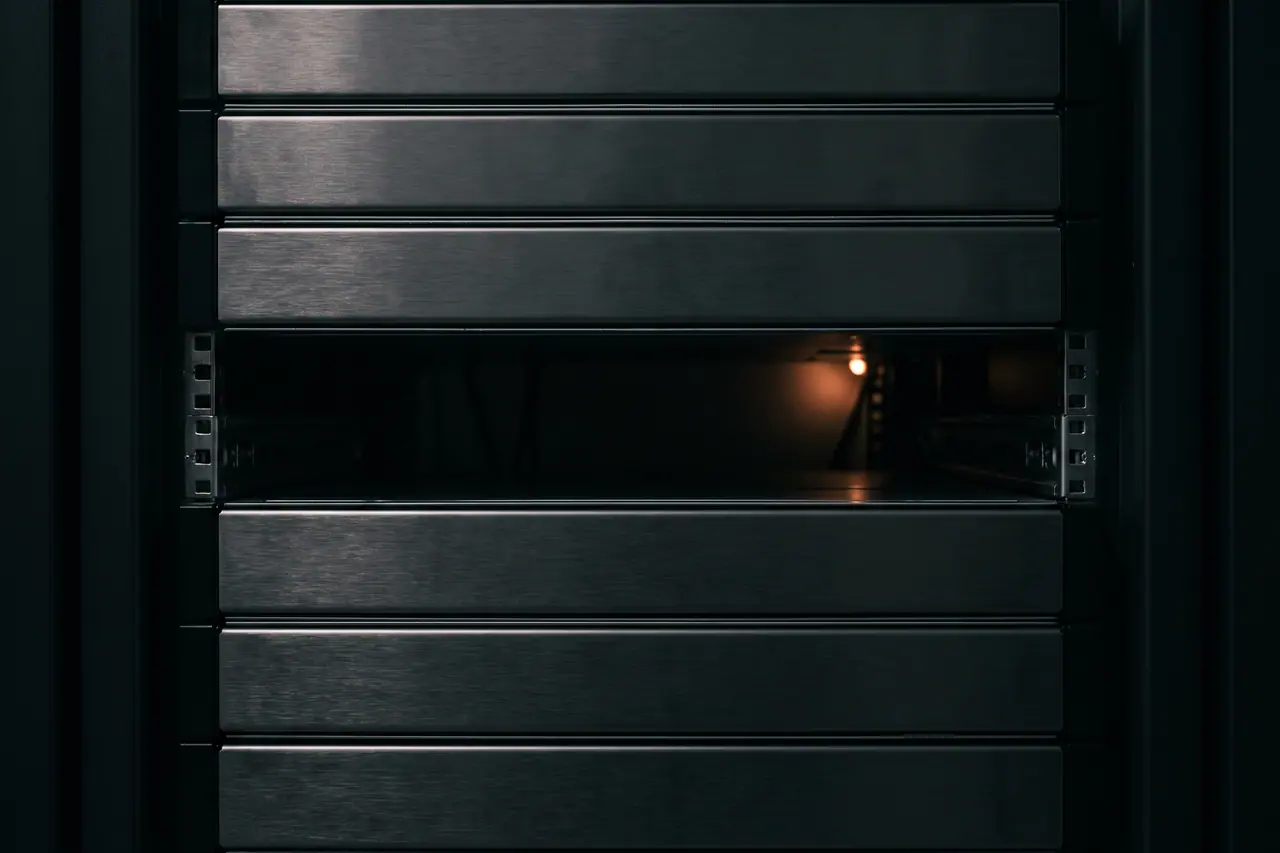 Several identical server chassis stacked in a row, status lights aligned.